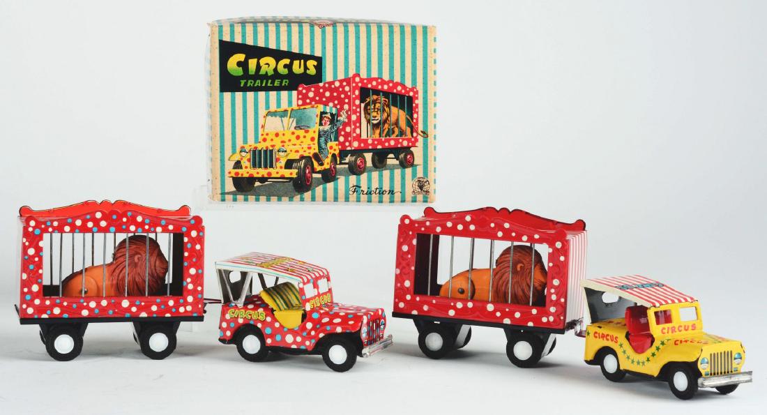 Lot of 2: Tin Litho Friction Circus Trailers.: The first is a tin litho, friction Circus Trailer, red polka dot version, Japan, SSS. Hard to find circus toy. Friction motor works, lion rises up in cage, marked "Circus" on hood and back fender, nea
