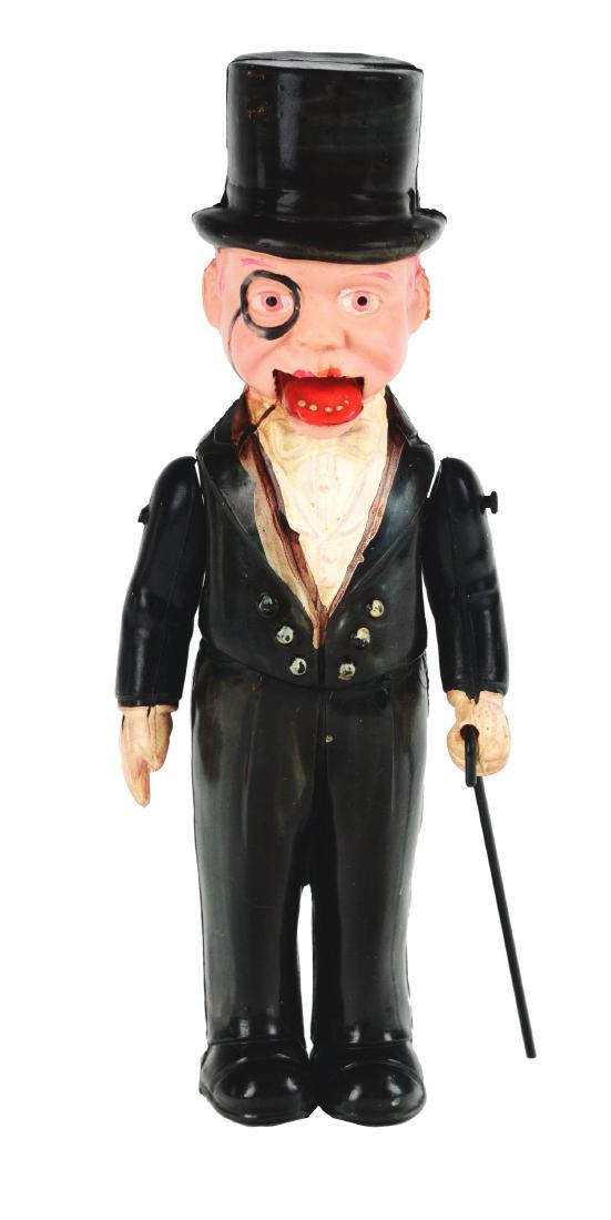 Pre-war Japanese Celluloid Wind Up Charlie McCarthy: SS. Scarce Charlie McCarthy, when wound, the offset weight in body causes Charlie to shake and move, mouth opens and closes, tiny split in upper lip, cane may be a replacement, excellent to near mint,