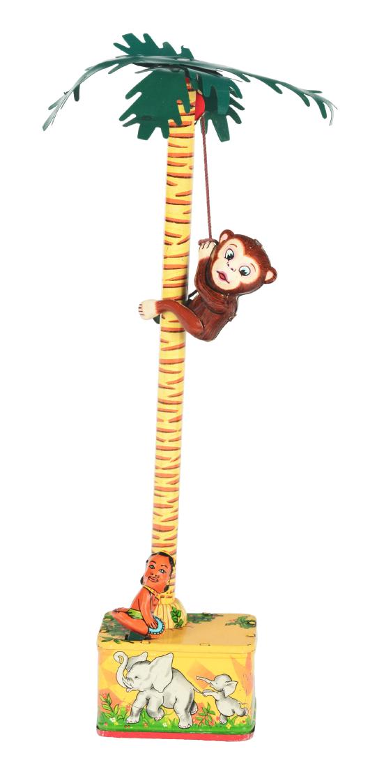 Tin Litho Native and Monkey.: Japan, Masudaya. Rare toy works when wound, native rocks back and forth while monkey climbs up and down the tree, near mint, 12-1/2".Condition: Dimensions: 13" x 3".