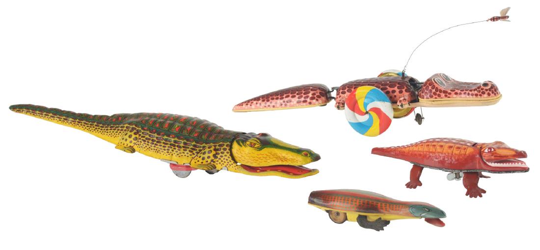 Lot of 4: Tin Litho Wind Up Crocodiles.: The first is a Crocodile Toy, U.S.A. When wound, it rolls forward, opens and closes mouth, excellent to near mint, 15". The second is a Crocodile, Japan, K. When wound, it walks forward, opens and clo