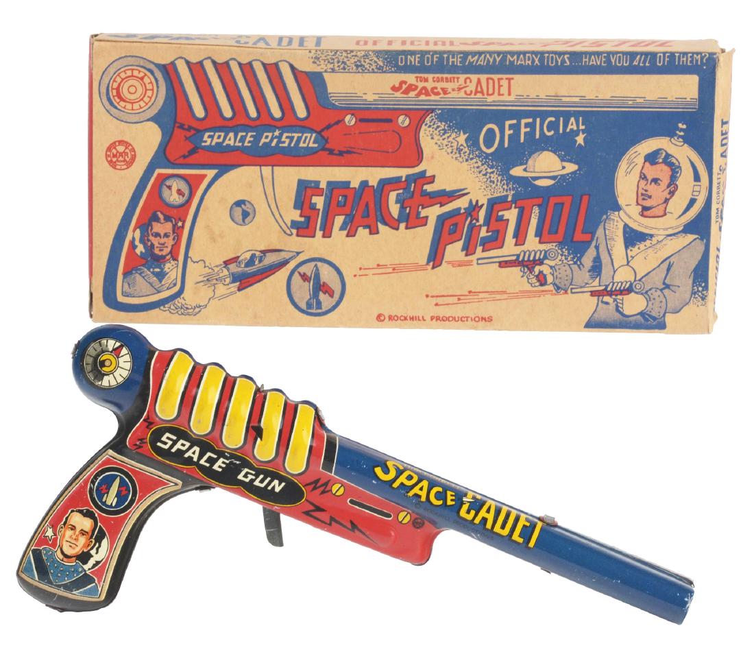 Marx Tin Litho Tom Corbett Space Cadet Click Pistol In: Includes scarce original box with great graphics of space scenes and Tom Corbett firing pistol. Box is marked "Rockhill Productions" for copyright. It is difficult to find the box this complete and cr