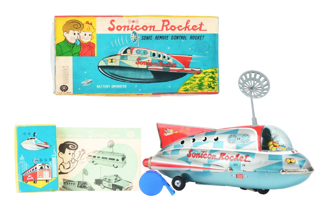Tin Litho Battery Operated Checkered Sonicon Rocket.: Japan, Masudaya. Scarce checkered version. Working, will change direction by use of blowing whistle, lights flash in back, marked "Sonicon Rocket", 14". Includes original box with inserts, instruction
