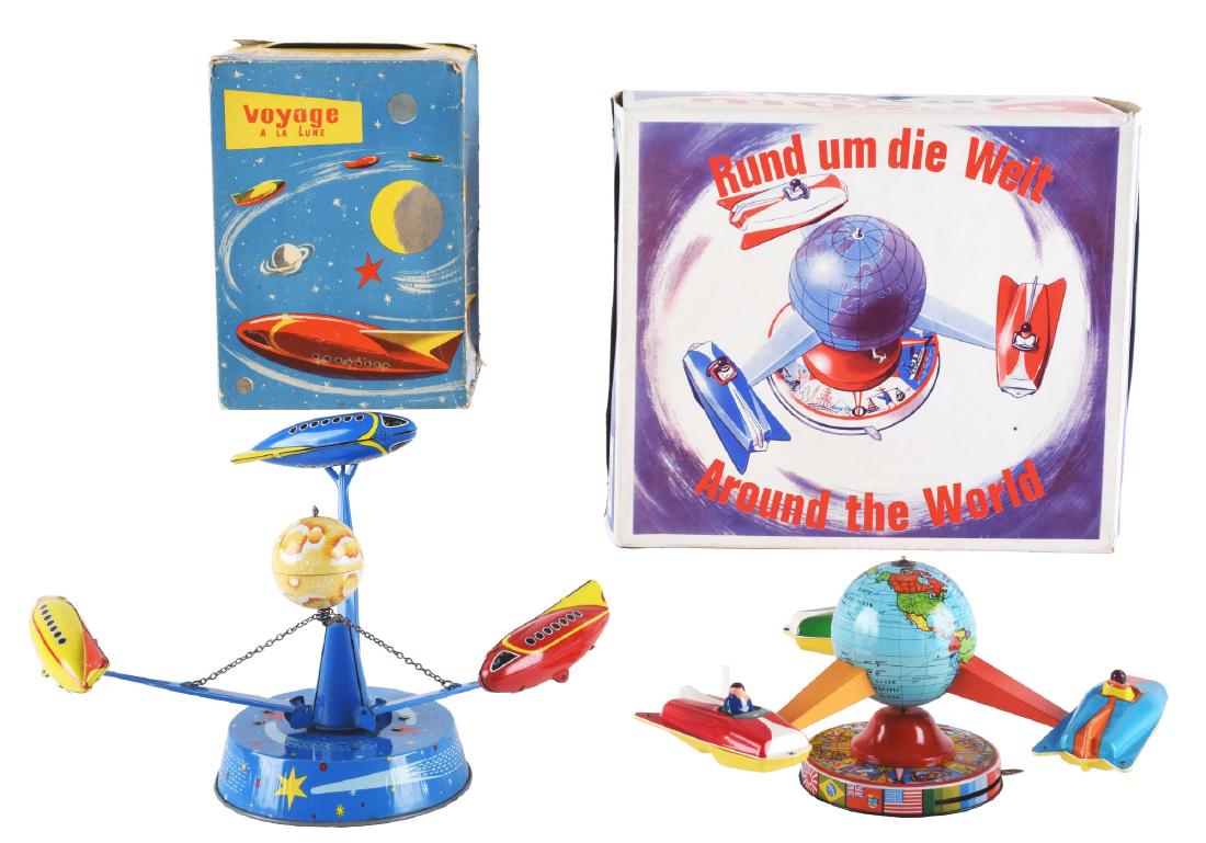 Lot of 2: Tin Litho Friction Wind Up Space Ship: The first is Voyage A La Lune, France. Working with unusual space toy with interesting action, excellent. Includes the original box with some corner splits and creasing, very good to excellent. The Ar