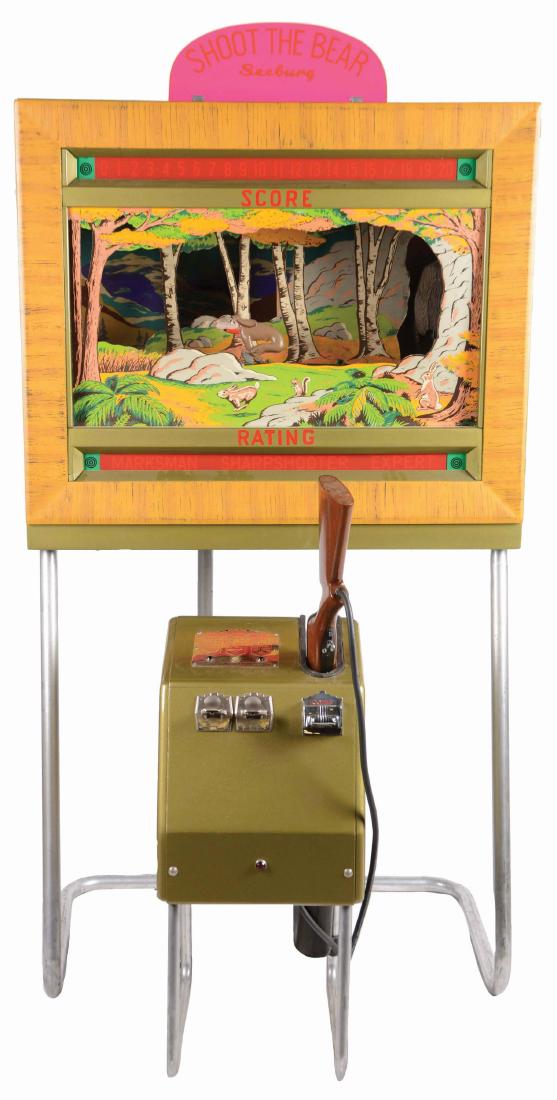 5¢, 25¢ Seeburg's Shoot The Bear Rifle Game.: This shooting range arcade machine was manufactured by Seeburg in 1949 and is in fantastic restored condition. The objective of this game is to gain points by shooting the bear who is in continuous mo