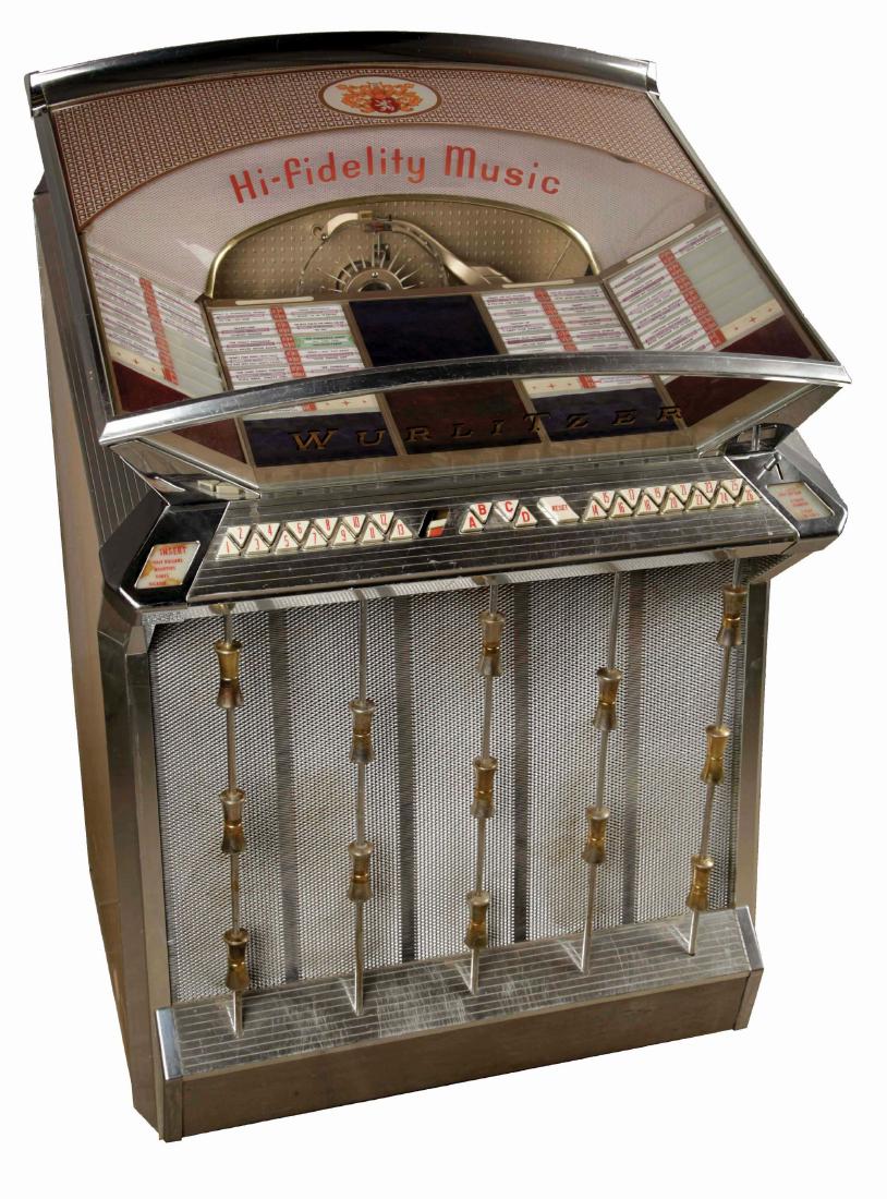 Multi-Coin Wurlitzer Model 2504 Phonograph Jukebox.: This jukebox offers 104 selections from as many as 52, 45 rpm records. Currently loaded with an assortment of records but not entirely filled. Featuring a curved glass top and triangular push buttons.