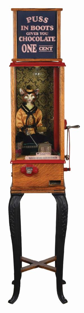 1¢ Puss In Boots Arcade Amusement Machine.: An excellent reproduction of the famed Puss In Boots fortune teller, originally manufactured by The Roover Brothers Co. from 1897 to 1904. Recreated by Mike Gorski, it is the first to be made with whi