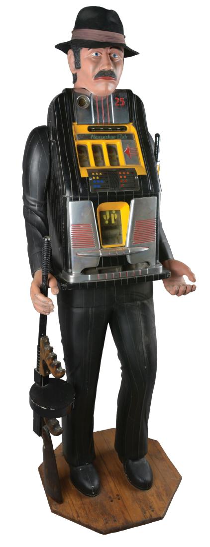 **25¢ Dick Delong Mills Horseshoe Club Slot Machine.: A Mills three reel slot machine housed in a magnificent figural stand created by the notable carver Dick Delong and resembling a mobster during the prohibition era. He is wearing a black pinstriped su