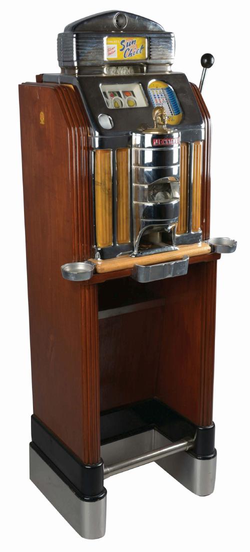 **$1 Silver Dollar O.D. Jennings Sun Chief Console Slot: Three reel slot machine produced by O.D. Jennings in 1949. The floor model machine features a nice original wood cabinet, a restored front casting with yellow light up plastics and marquee. Includes a