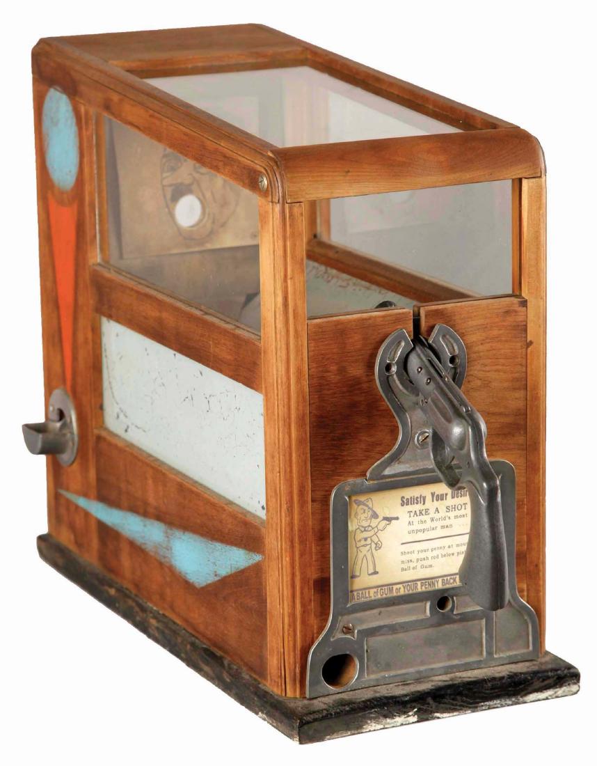 1¢ Paul Bennet & Co. Hitler Gum Target Arcade Game.: A WWII themed target practice counter game, featuring Hitler as the target. Manufactured by Paul Bennet & Co. in the 1940's. Place the penny in the slot, aim at Hitler's mouth and shoot. Receive a bal