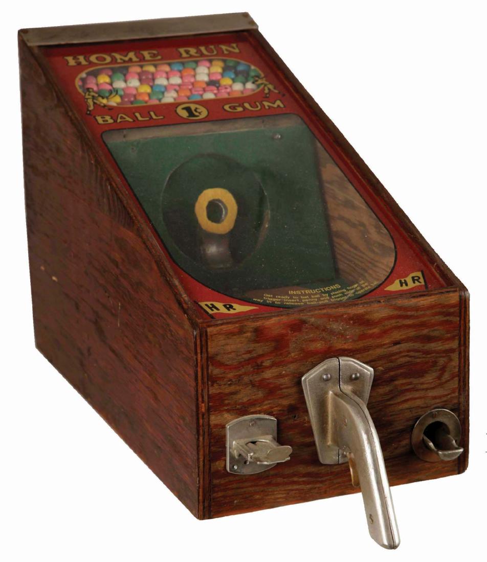 1¢ Victor Vending Corp. Home Run Arcade Game.: The objective of this counter game is to bat the released ball into the target but win or lose, a ball of gum is provided. The machine is encased in oak with front glass and a cast aluminum pistol gri