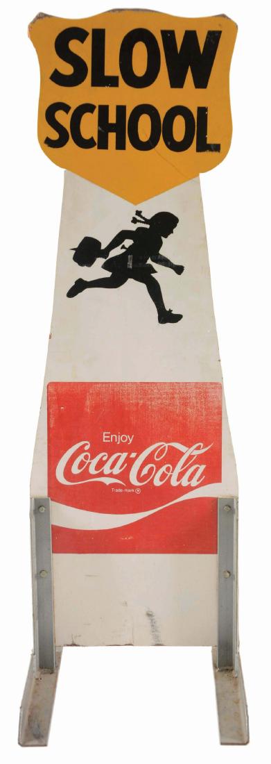 Coca-Cola Slow School Wooden Sign.: The base of this sign has wheels on one side for easy transport. The top edge has wear on one side. The bottom Coca-Cola logos have some fading. Condition: (Very Good). Dimensions: 16" x 33" x 50 -1/4