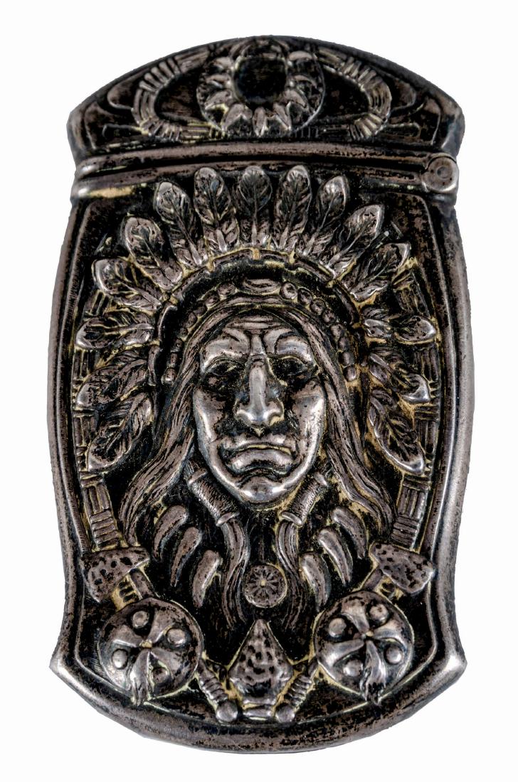Sterling Indian Chief Vesta Match Safe.: Silver match safe with repoussé Indian chief portrait to front continuing to reverse with war clubs beneath him. Hinged lid has bear claw necklace in relief, match strike to bottom. Gorham Manufactur