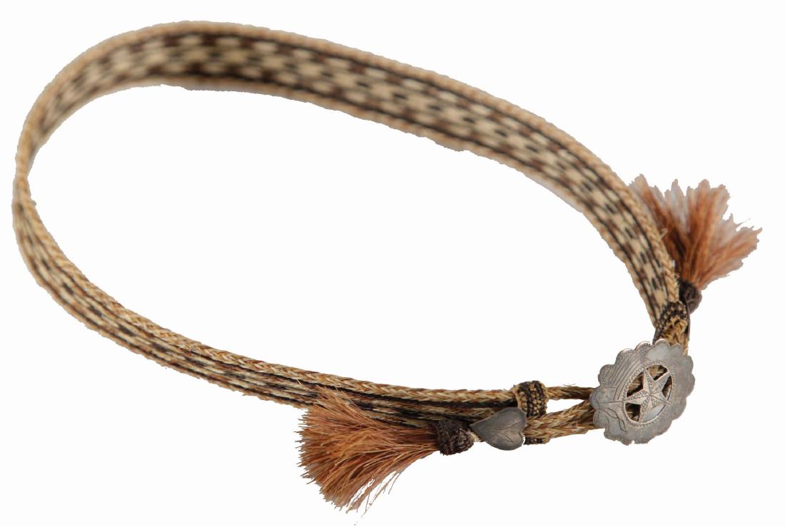 Early Horsehair Hatband.: Desirable braided horsehair hatband, using three natural colors, with decoratively tasseled ends and accented by fantastic sterling silver hearts and star medallion.Condition: (Very Good).Dimensions: