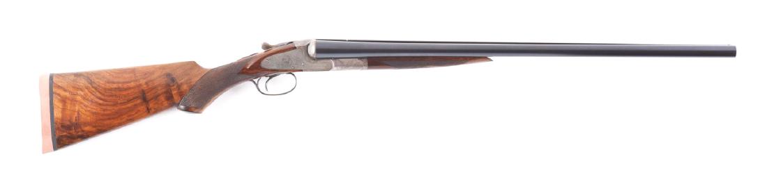 (C) L.C. Smith Grade 2E 12ga SXS Shotgun with Hunter: Made with Hunter One Trigger, auto-ejectors, and non-auto safety. Gun has a capped pistol grip buttstock that is checkered in two point pattern through the wrist and terminates with a replacement mode