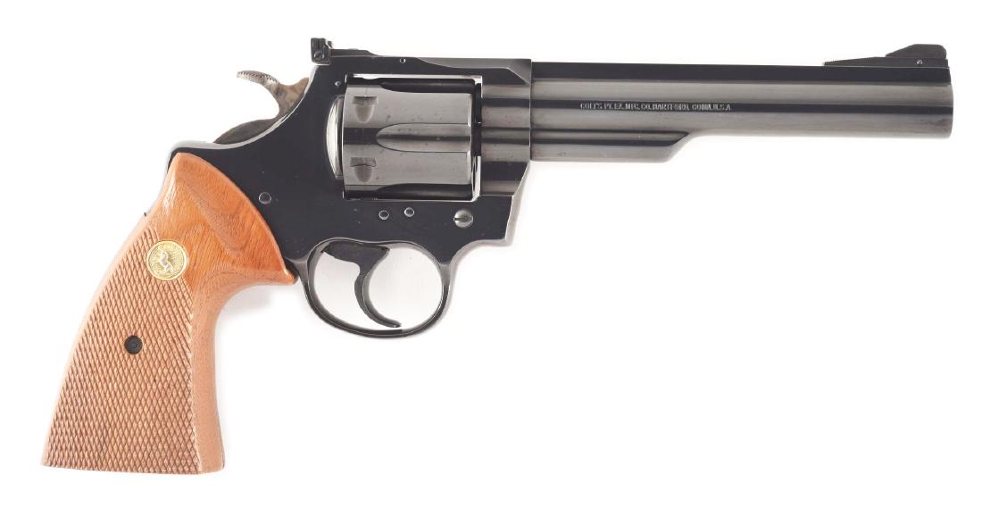 (M) COLT TROOPER MK III DOUBLE ACTION REVOLVER (1978).: Features blued finish, six shot, fluted cylinder, double action, target adjustable rear sight, wide spur target hammer, and gold medallion checkered walnut grips. CONDITION: Gun has been fired with a 