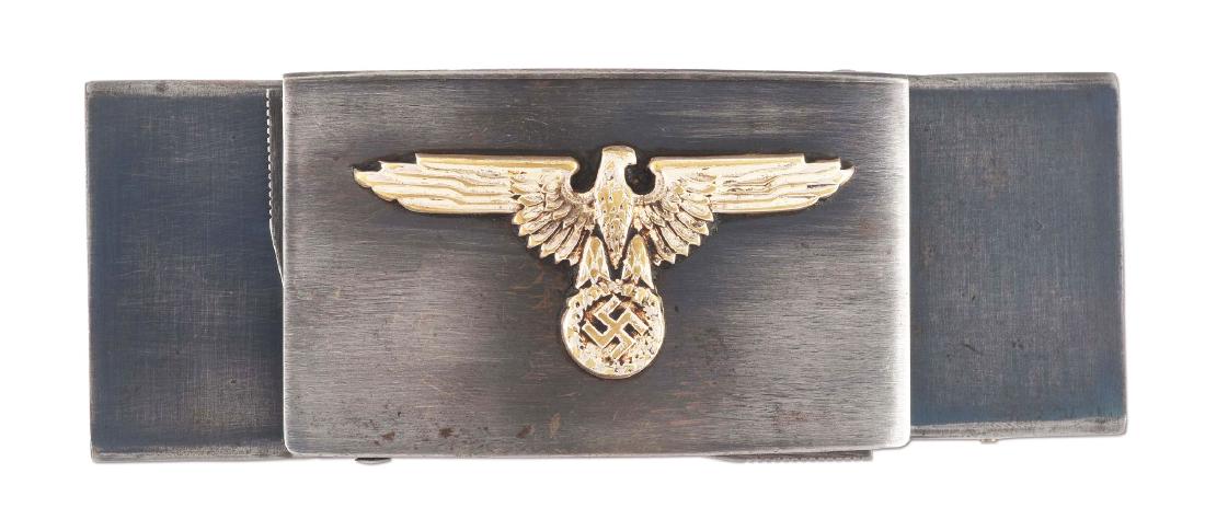 (C) GERMAN WORLD WAR II .22 CALIBER KOPPELSCHLOSS BELT: Interesting German belt buckle gun. Nefarious undercover weapon consisting of four barrel derringer which is hinged to hide under flip-up cover. When in a desperate situation, wearer can press dual lo