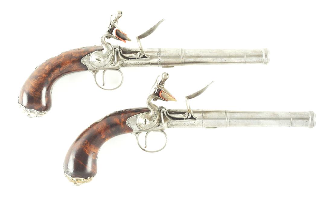 (A) FINE PAIR OF BRITISH SILVER MOUNTED SCREW BARREL: A fine pair of classic "Queen Anne" turn off pistols by a renowned maker of this type, Robert Wilson. 5-1/4" turn off barrels with cannon muzzles and border engraving at breech. Breech is well engrave