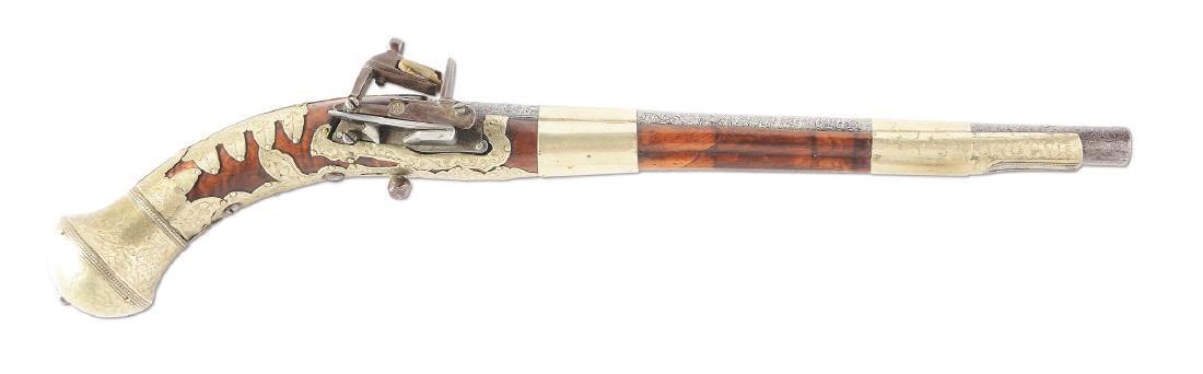 (A) Caucasian Miquelet Cossack Pistol.: Features a tapered round watered barrel with chiseled Eastern designs near the breech. The miquelet lock features a sunken cartouche with unknown makers mark. The fruitwood stock is overlaid with flor