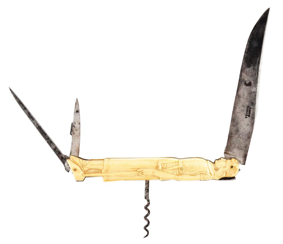 FRENCH FOLDING KNIFE WITH ELABORATELY CARVED HANDLE: Ivory scales carved in high relief with a soldier in the Pre-Raphaelite style, armed with a sword. The clip point master blade is marked A RIBIS, HABANA on its face; the two smaller blades are a cutti