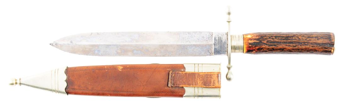 A Fine English Presentation Spearpoint Bowie Knife: This is a spear point Bowie knife made by the Lockwood Brothers and maker marked on the ricasso "CTX Lockwood Brothers". It features a spear point double edged blade, German silver furniture with bulb