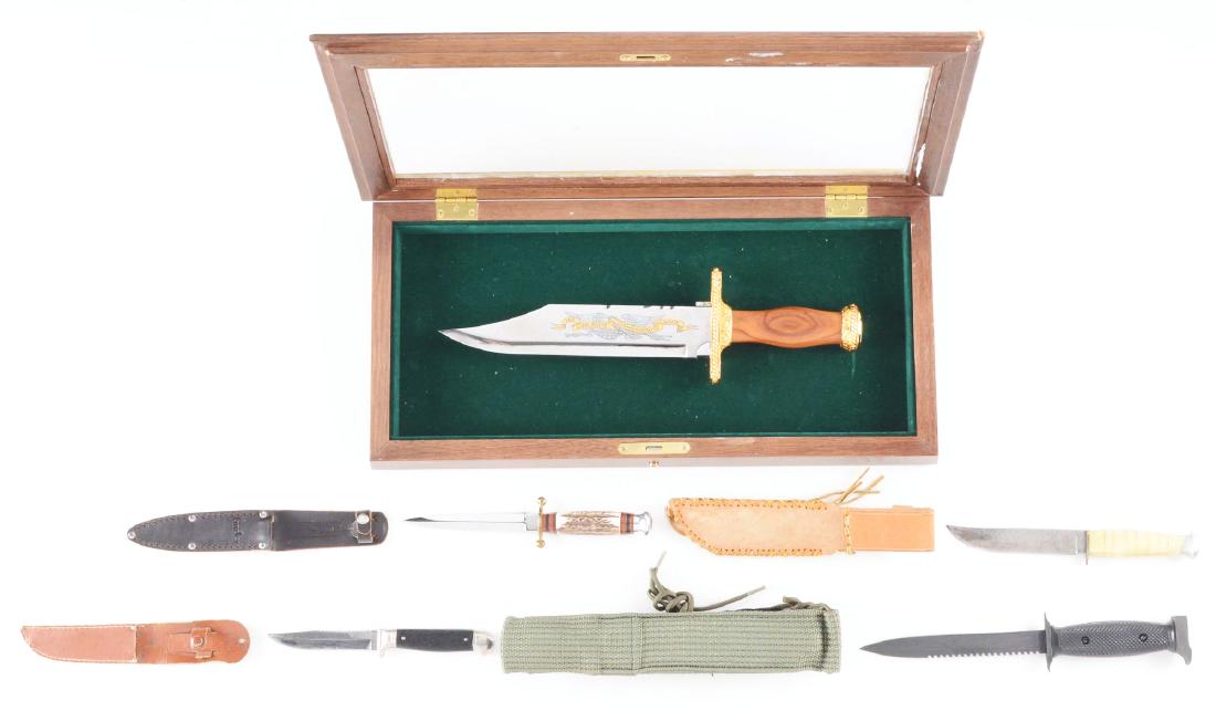 LOT OF 5: ASSORTED KNIVES WITH ACCESSORIES.: Lot consists of (A) John Wayne Commemorative Bowie, produced by the Franklin Mint. This gargantuan knife has a beautifully etched blade depicting an eagle with an American flag in its talons and a rib