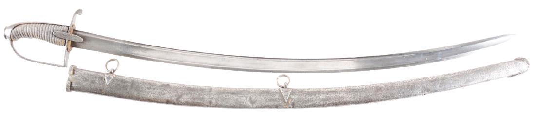 A Rare English Pattern 1788 Light Cavalry Saber by: The 35" blade with one wide fuller and a single narrow fuller, indistinctly signed on spine Woolley & Company. Steel stirrup hilt with long langetes, fish skin grip. Original steel scabbard marked "Wo