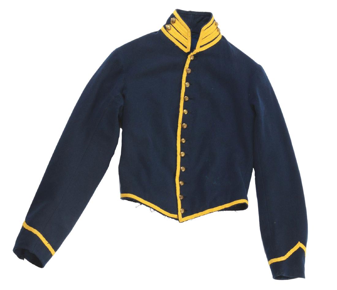 CIVIL WAR UNION CAVALRY SHELL JACKET.: Civil War Union Cavalry enlisted man's regulation shell jacket. Original rough blue wool lining to the inside with cotton sleeve linings. CONDITION: Retains the original "WATERBURY" federal eagle butt