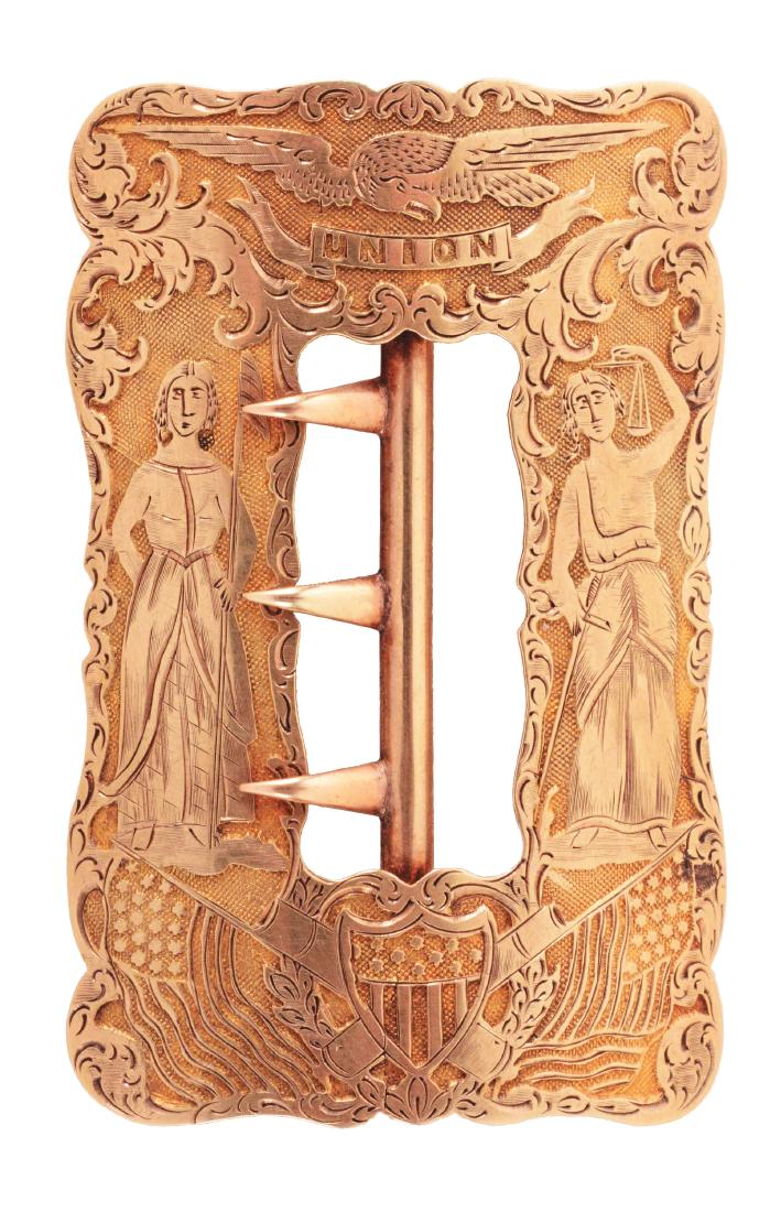 14 KARAT GOLD PRESENTATION BELT BUCKLE CIRCA 1880.: Beautiful solid gold buckle that measures 1-1/2 x 2-1/2" and features Lady Liberty and Justice, stamped Union, with Eagle, shield and cannon. CONDITION: Near mint with no presentation. Weighs 10.7 pen