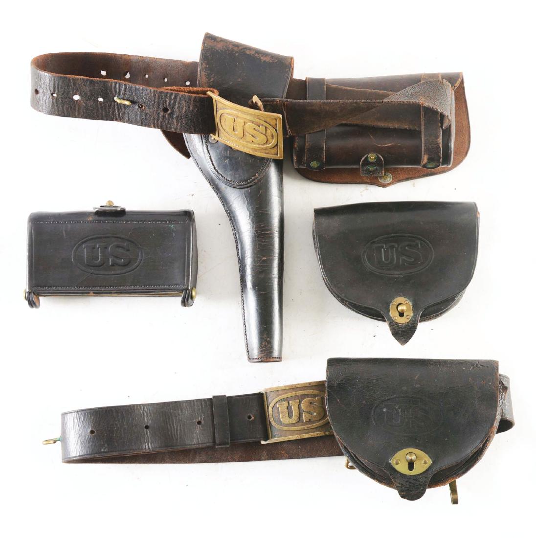 LOT OF 4: INDIAN WARS ERA BELTS, CARTRIDGE POUCHES AND: Lot consists of: (A) Original Indian Wars era cavalry setup as worn on campaign in the era of the Apache Wars. M1881 holster with large embossed “US” on front and two position flap to accommodate 