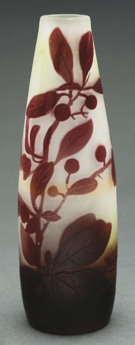 Galle Cameo Vase.: Galle vase has maroon cameo decoration of stems, leaves and berries rising from the foot against a frosted cream colored background. Signed on the side in cameo "GALLE". There is an acid burn in the c