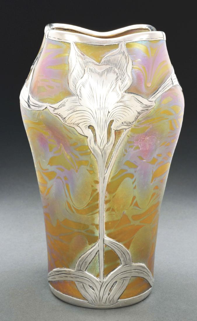 Loetz Phaenomen 2/474 Overlay Vase.: Loetz vase with pinched body and ruffled rim is decorated in Phaenomen 2/474 decor having an irregular pattern of iridescent threading and hearts over a Candia ground, finished with silver floral over