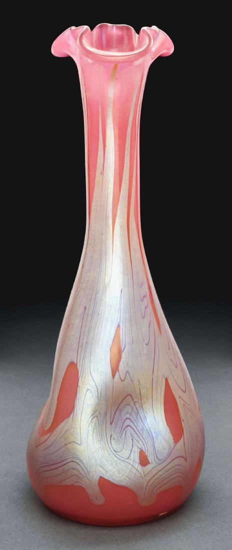 Loetz Phaenomen 7773 Vase.: Loetz vase has pinched tapering body with flared and ruffled rim, decorated in Phaenomen 7773 decor, with silver iridescent bands against a pink ground. Signed on the underside "LOETZ AUSTRIA". Very G