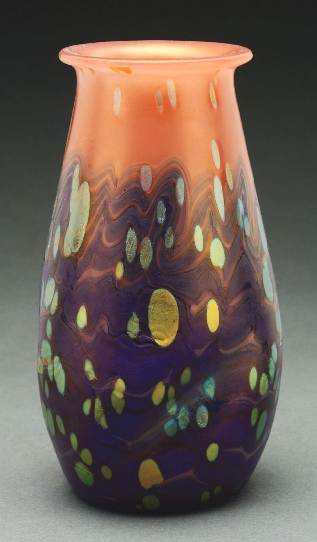 Loetz Cytisus Vase.: Loetz vase in the Neurot Cytisus decor has crimped 'new red' ground with cobalt wavy bands and iridescent spots encircling the body of the vase. Unsigned. Very Good to Excellent. Condition: Dimensions