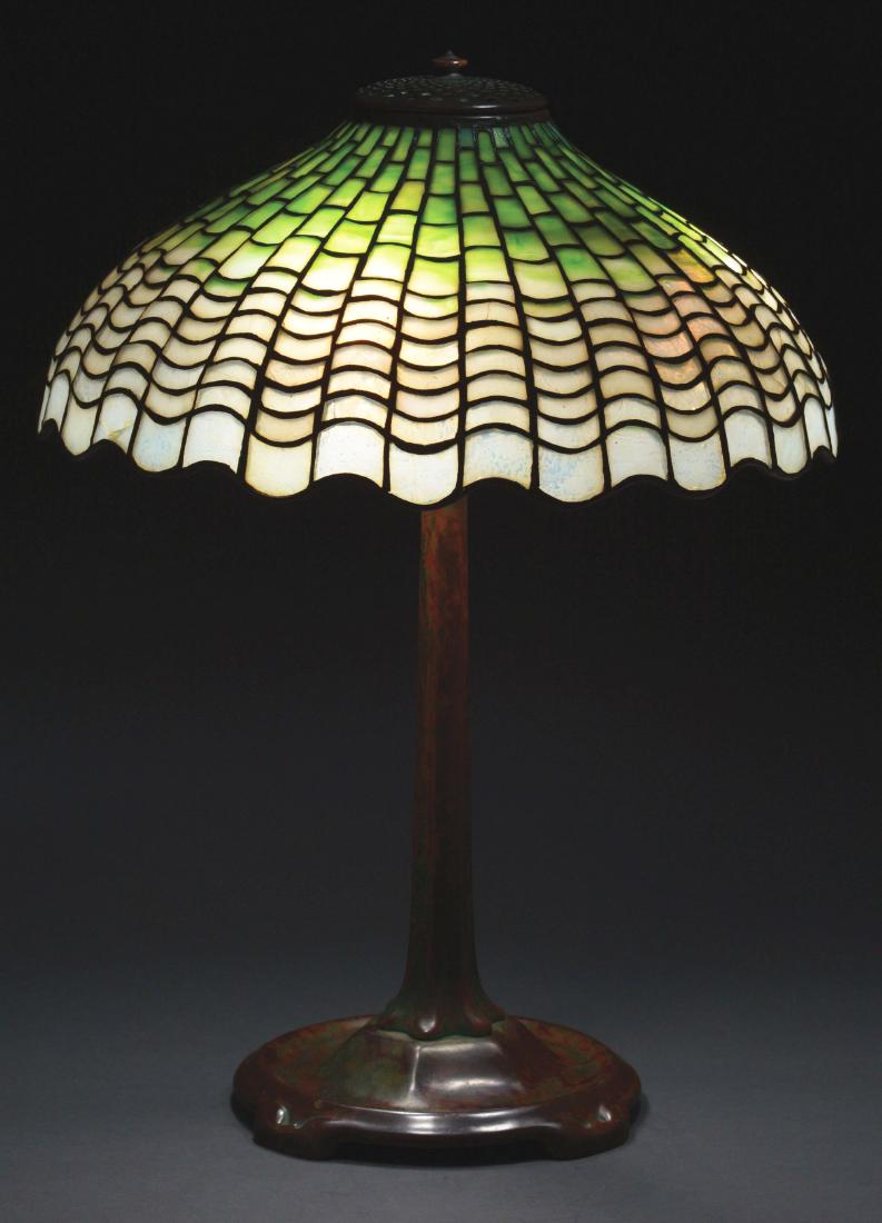 Tiffany Studios Leaded Table Lamp.: Tiffany Studios table lamp has a leaded glass shade in the shell design with shell shaped panels ranging from mottled white at the bottom to green at the top. The shade is signed on the interior "TIFF