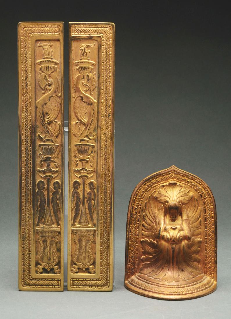 Tiffany Studios Spanish Blotter Ends and Bookend.: Tiffany Studios bronze items in the Spanish pattern include a single bookend and a pair of small blotter ends. The pieces are finished in a rich gold patina and each is signed "TIFFANY STUDIOS NEW YOR