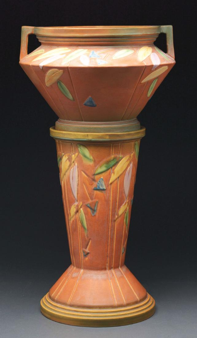 Roseville Pottery Futura Jardiniere and Pedestal.: Roseville Pottery, Futura Pedestal and Jardiniere 616-10, Circa 1924. Terra-cotta with multi-colored leaves. 18-1/4"H x 11-1/4"D at base, 9-1/4"D at top. There is a hairline crack running approximatel