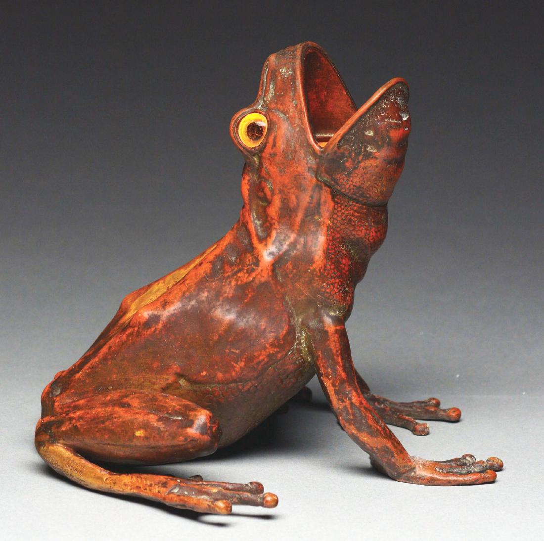 Carl Kauba Bronze Frog Lamp.: Bronze frog lamp by Carl Kauba is looking upwards with open mouth, the frog has glass eyes and is finished with a reddish-brown patina. The light socket is inside the frogs mouth, and the eyes would b