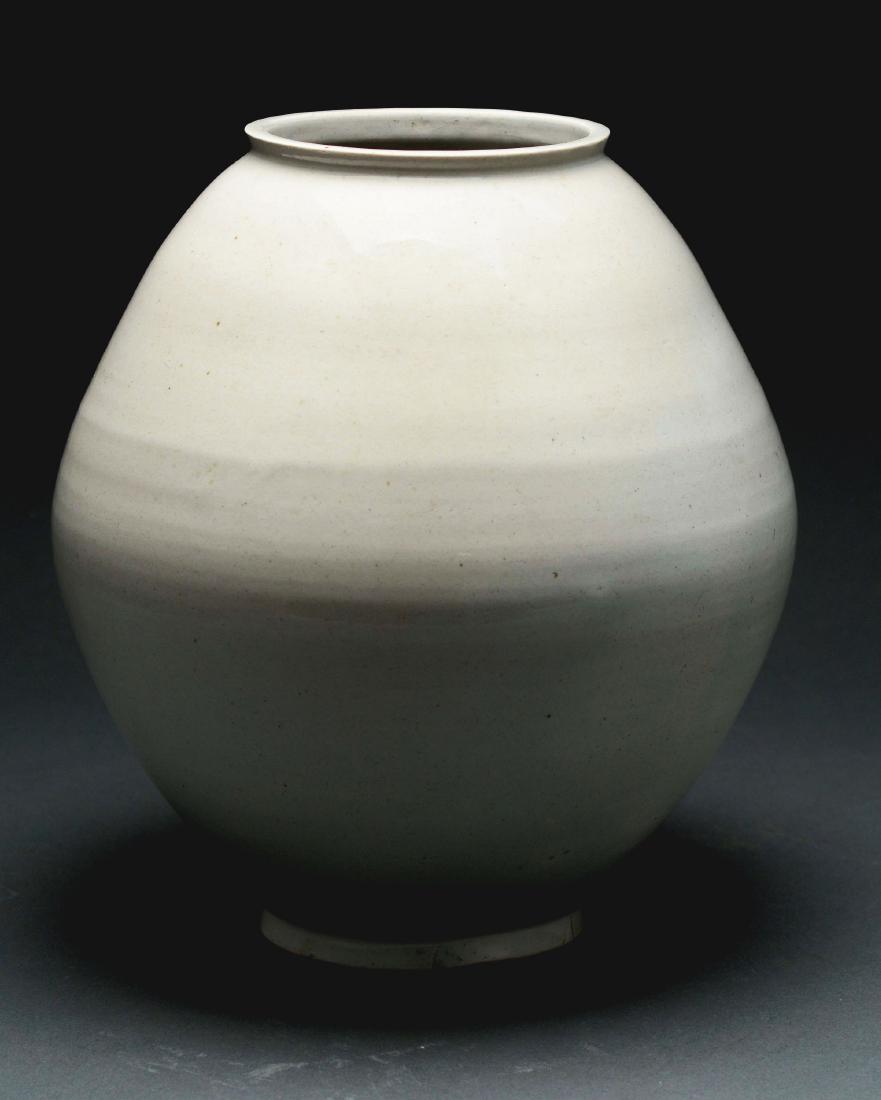 Large Bulbous Asian Stoneware Signed Moon Vase.: Possibly Korean. This nice example with a fine subtle flared rim and foot, with an undecorated cream/white glaze. Large bulbous hand spun ceramic moon vase in gray, and signed under base in underglaze