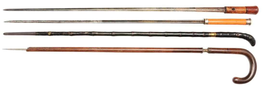 Lot of 4: Antique Sword Canes, 2 without Sheaths, 2: Lot consists of two sword canes which are missing their sheaths, and two that are complete with their sheaths. The blades are all engraved. Condition: (Excellent). Dimensions: Largest: 35 - 1/4" L.