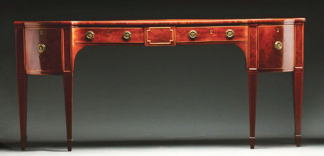 Fine Georgian Style Inlaid Mahogany Sideboard.: First half 19th century. England. This well proportioned sideboard with rectangular top, bowed ends, and incurved center with contrasting string inlay. The case fitted with a central short drawer with