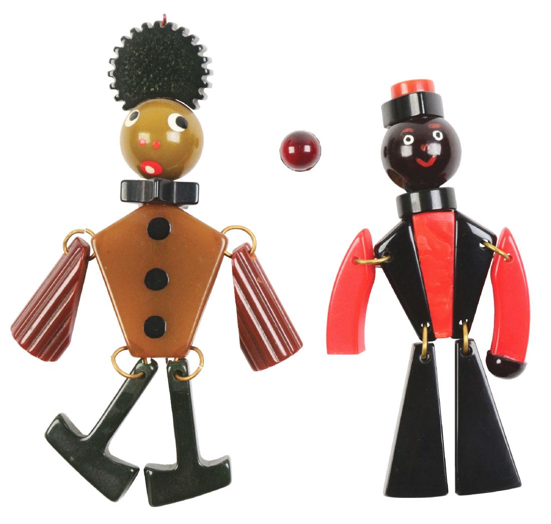 Lot of 2: Figural Bakelite Pins.: Pair of bakelite figural butler pins. Great detail and color. Condition: (Excellent). Dimensions: Largest: 3 - 3/4" x 1 - 1/2".
