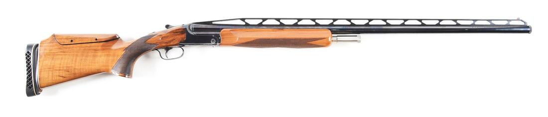 (M) PERAZZI TMX SPECIAL SINGLE BARREL TRAP SHOTGUN WITH: Newer model, but not current, this gun features high rib, ported barrel, interchangeable chokes, removable trigger group, adjustable comb and pad. 34" barrel. Extreme pistol grip. Lightly streaked and