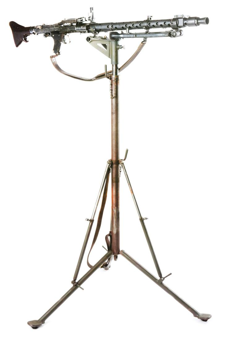 DUMMY WWII NAZI GERMAN MG34 MACHINE GUN WITH: Built utilizing original parts on a solid aluminum receiver with Bakelite stock, brown leather sling, bipod, and standard sights. 936 code on parts, dated 1940. Accompanied by an anti-aircraft tripod 