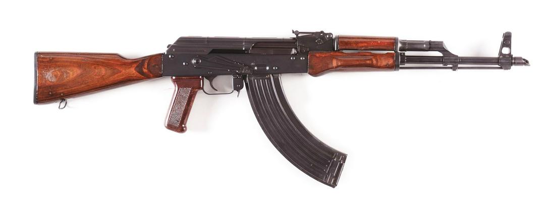(M) JAMES RIVER JRAK47 SEMI-AUTOMATIC RIFLE WITH: Standard AK pattern rifle with wooden furniture and brown plastic grip. Stamped metal receiver. Tapco 62 trigger. Marked for James River just forward of magazine well. Slant brake. Comes in what appea