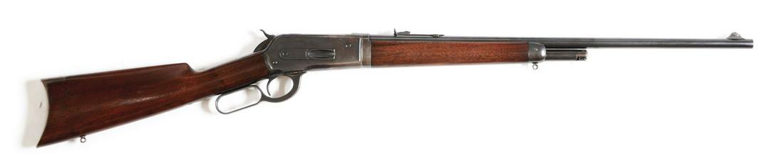 (C) WINCHESTER MODEL 1886 LIGHTWEIGHT TAKEDOWN LEVER: Fairly standard fare, early production , takedown light weight rifle chambered for the .33WCF cartridge. Features half magazine, blue finish, sling eyes, walnut stock with rifle butt. CONDITION: 90%+ 