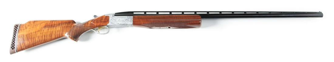 (M) BROWNING BT99 PIGEON GRADE SINGLE BARREL TRAP: High Grade Browning Single Barrel Trap shotgun with matted ventilated rib and two steel beads. Large trap forend is checkered in point pattern with Deeley release. Action is near full coverage engrave