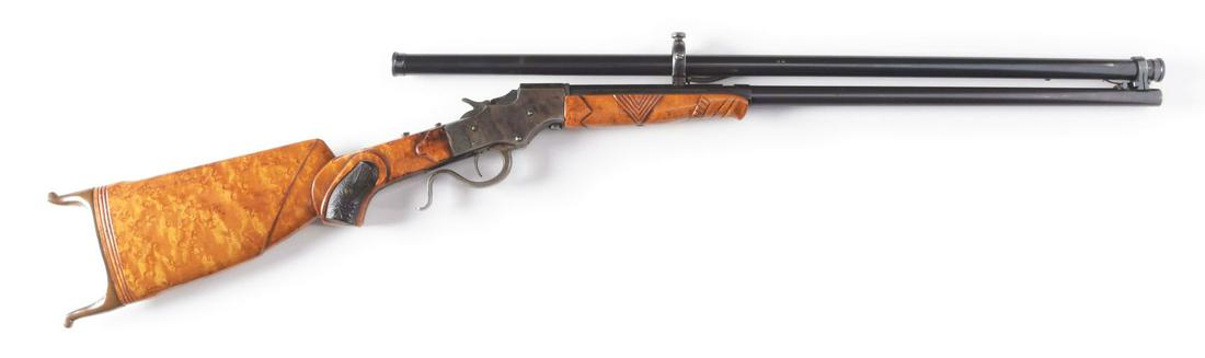 (C) STEVENS FAVORITE CUSTOM SINGLE SHOT RIFLE.: This custom Stevens Favorite Model features an octagon barrel with spacer ring at breech, case color frame, bird's eye maple stock with actual pistol grips set into wood, carved forend, and brass Swis