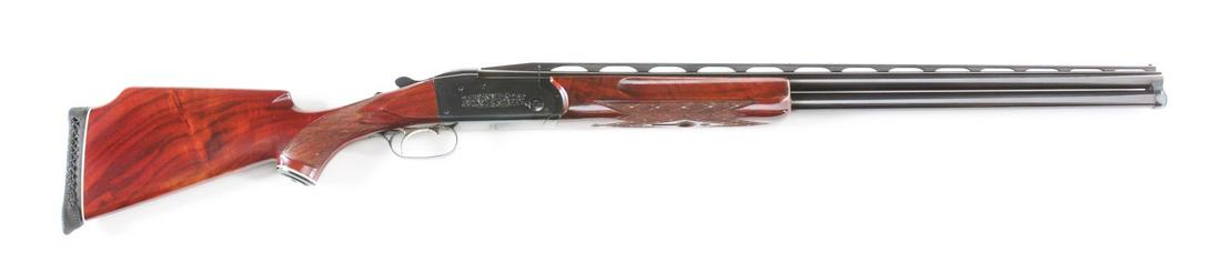 (M) KRIEGHOFF MODEL K-32 OVER UNDER 12 BORE SHOTGUN.: Well made earlier K-32 in Trap configuration. Barrels with raised matted ventilated top rib with white front bead and steel mid bead. Skip line checkered forend with grooves on sides has Deeley releas