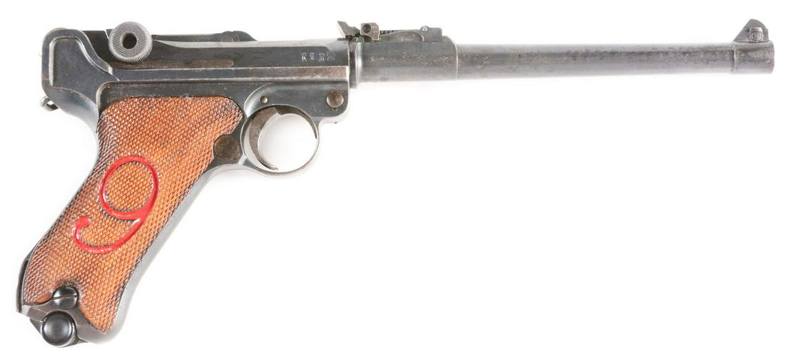 (C) 1917 DWM RED NINE ARTILLERY LUGER SEMI-AUTOMATIC: Features include round barrel with inverted V fine tune front sight, nine position fine tune artillery rear sight, toggle action, finely checkered walnut grips with a "RED NINE" on both grips, straw s
