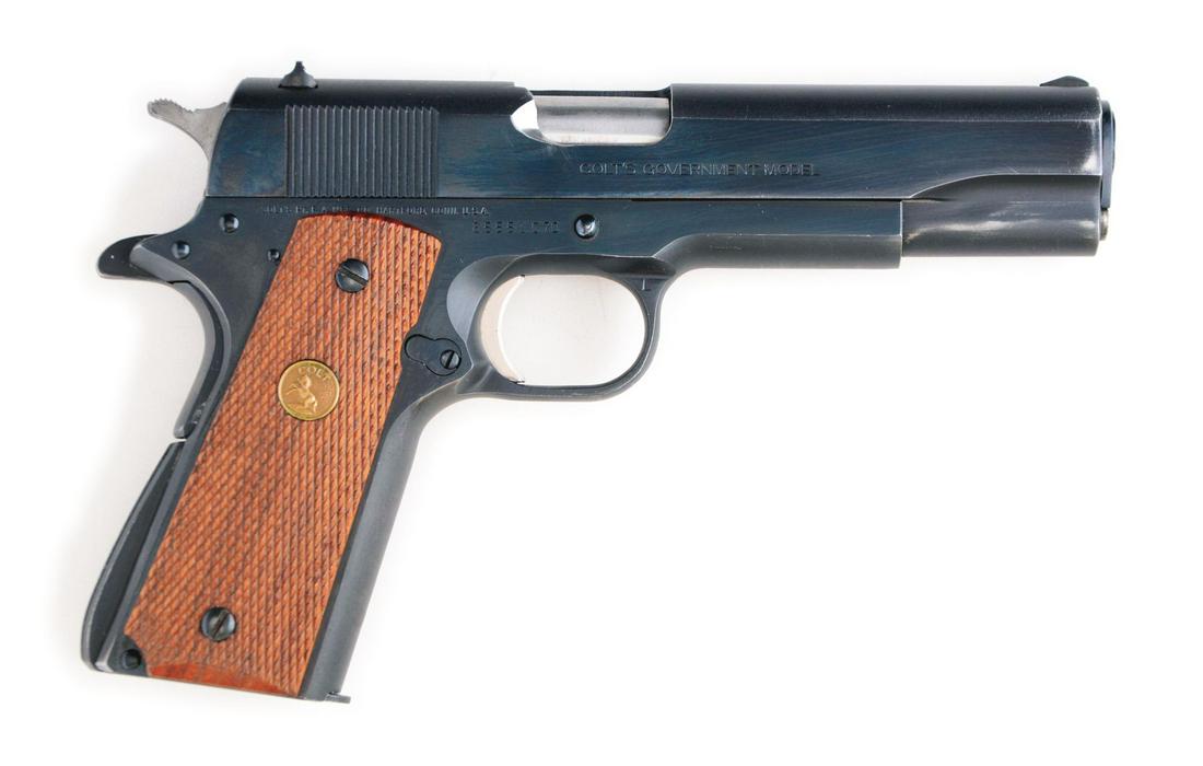 (M) COLT 1911-A1 SERIES 70 .45 SEMI-AUTOMATIC PISTOL: Standard fare classic Series 70 Colt in .45 caliber. Blue finish with fixed sights and gold medallion checkered walnut grips. CONDITION: Gun shows light use only. A bit of wear at muzzle, some forward